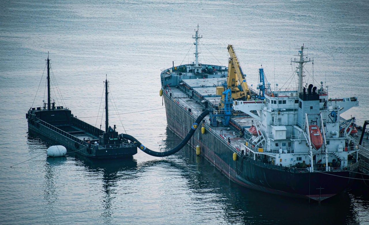 Bunker barge alongside a bulk carrier at anchorage